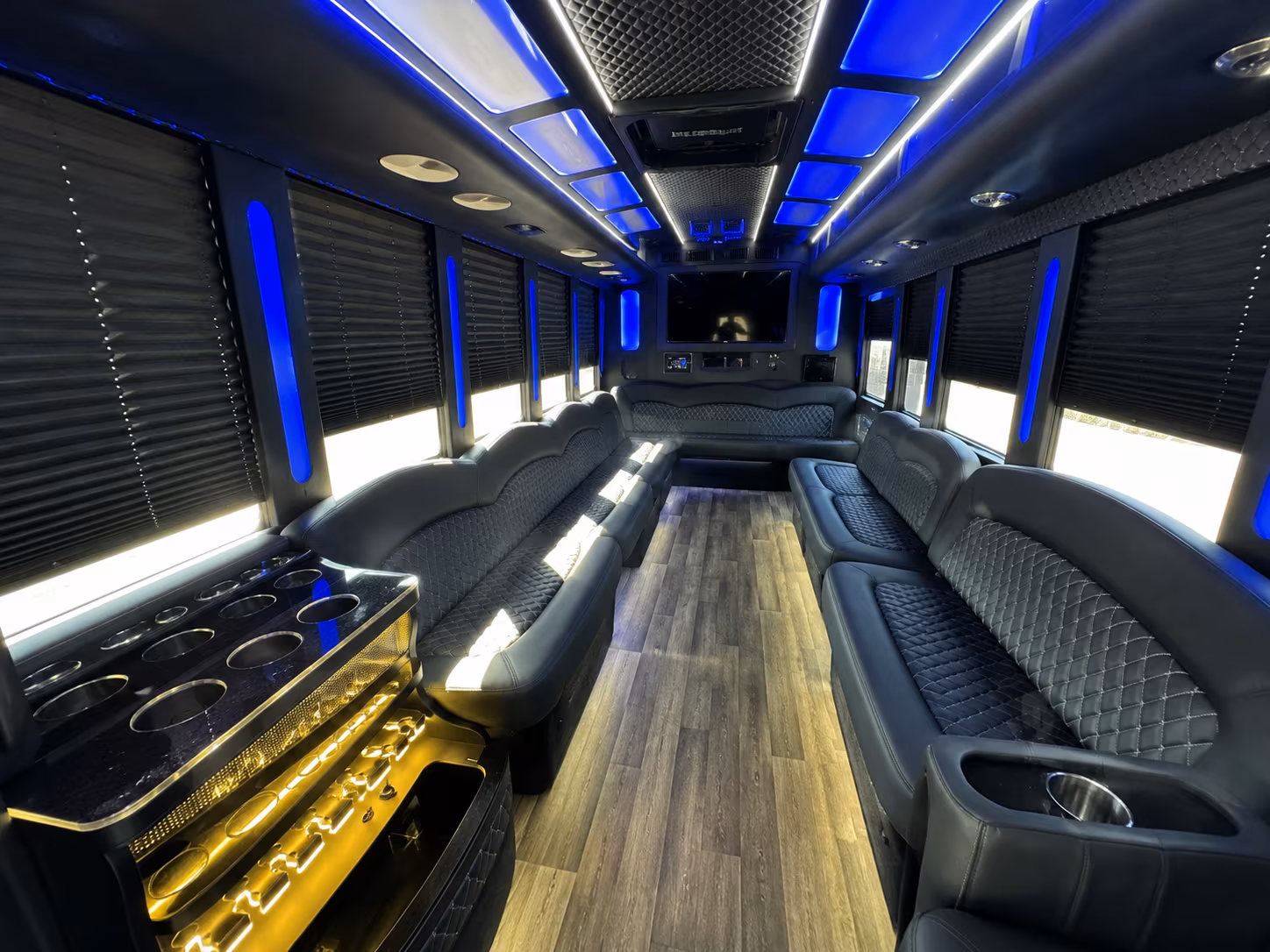 Friends laughing during a party bus celebration in Scottsdale